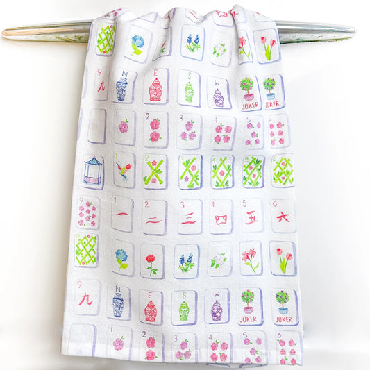 Taylor Paladino Mahjong Tea Towel in cream with colorful mahjong tile grid pattern featuring flowers and symbols