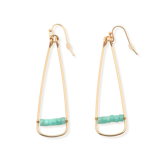 The Leslie Curtis "Katie" Earrings by Leslie Curtis are gold wire dangle earrings, each designed in an elongated triangle shape and adorned with a row of small turquoise beads along the bottom. These eye-catching 2.5-inch earrings feature 18k plated gold hooks and come with clear rubber stoppers for a secure fit.