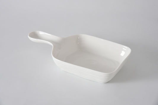 Pampa Bay Le Blanc serving dish with handle in white ceramic with linear texture