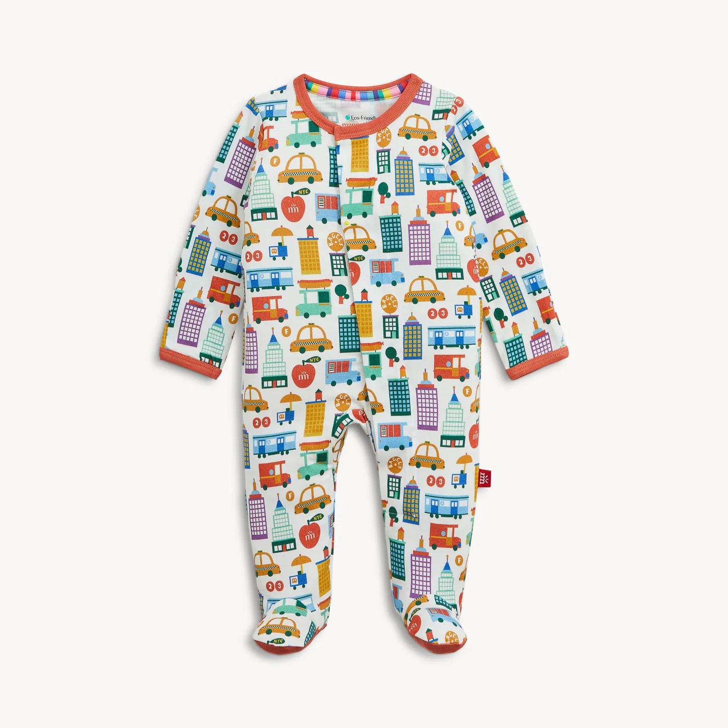 The Magnetic Me "Know Your NYCs" Footie features a vibrant pattern of cars, buses, buildings, and traffic lights on a white background, with bright orange cuffs and collar. This cozy modal sleeper from Magnetic Me includes convenient magnetic closures for easy changes.