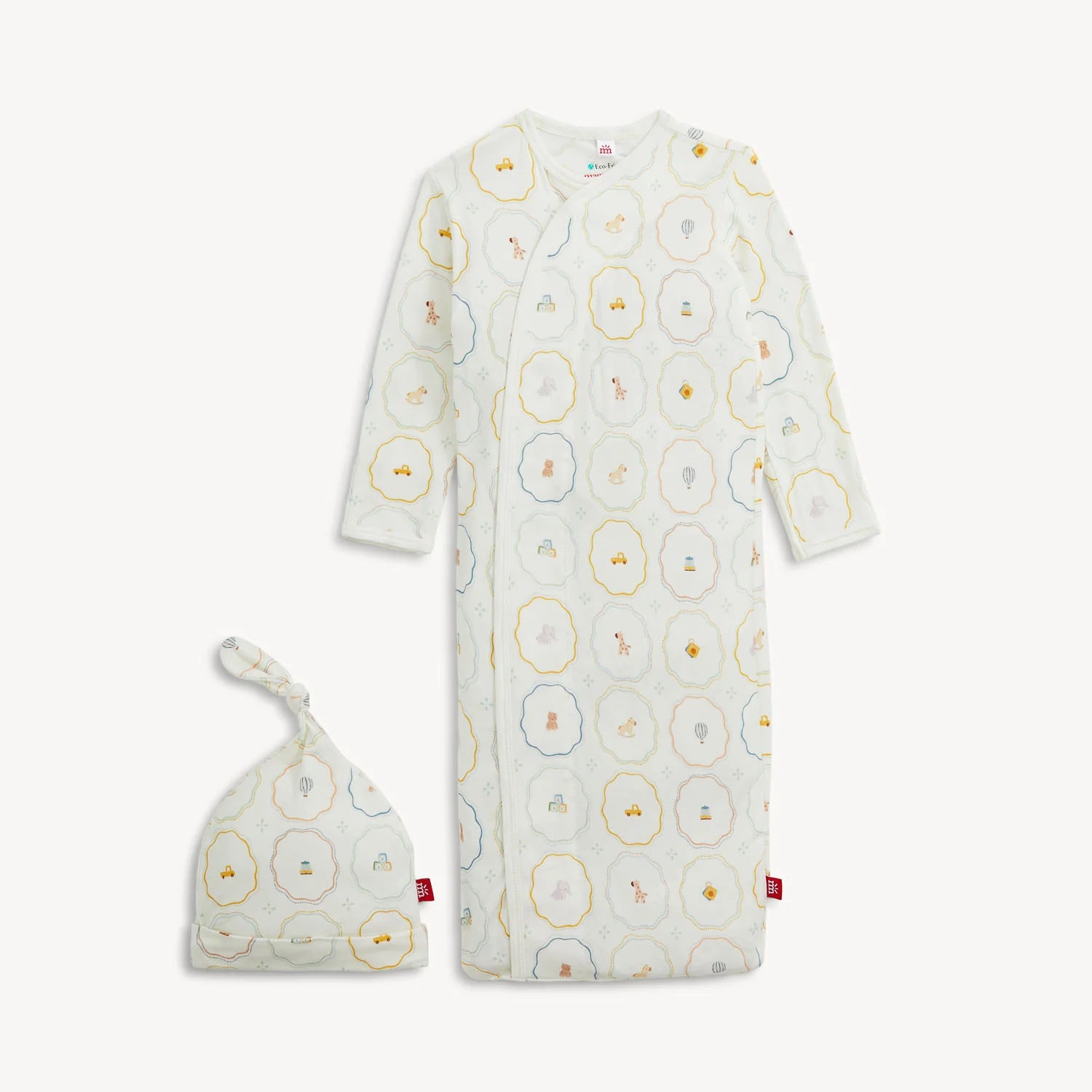 The Magnetic Me Nursery Magic Magnetic Gown & Hat Set by Magnetic Me features a soft TENCEL™ modal gown with long sleeves and a matching knotted hat, both adorned with playful animal and geometric prints in pastel shades. The gown is designed with handy magnetic closures for effortless dressing.
