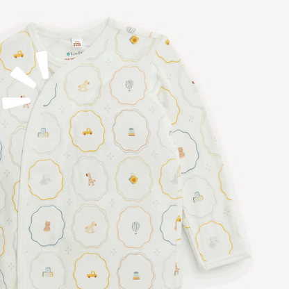 The Magnetic Me Nursery Magic Magnetic Gown & Hat Set by Magnetic Me is crafted from soft TENCEL™ modal and features a charming pastel animal and vehicle pattern on a white background, with convenient magnetic closures for easy changing.