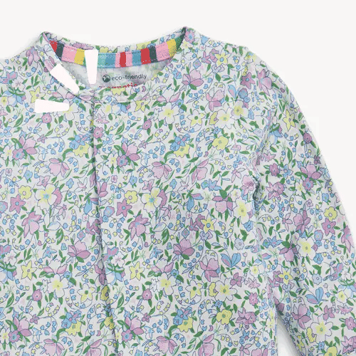 Magnetic Me Lavinia Footie with multicolored floral print in purple, pink, yellow, and green on white