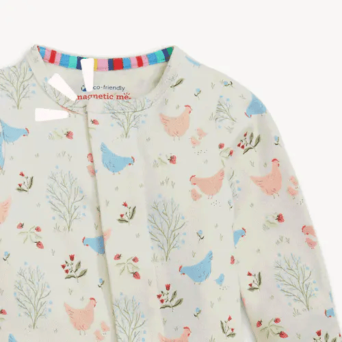 Magnetic Me Chicken Tender footie front neckline detail with rainbow magnetic closure trim