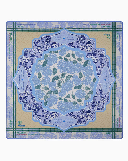 Oh My Mahjong Luna Mat in blue and green with blue and white chinoiserie border, floral center pattern in pale blue and sage green