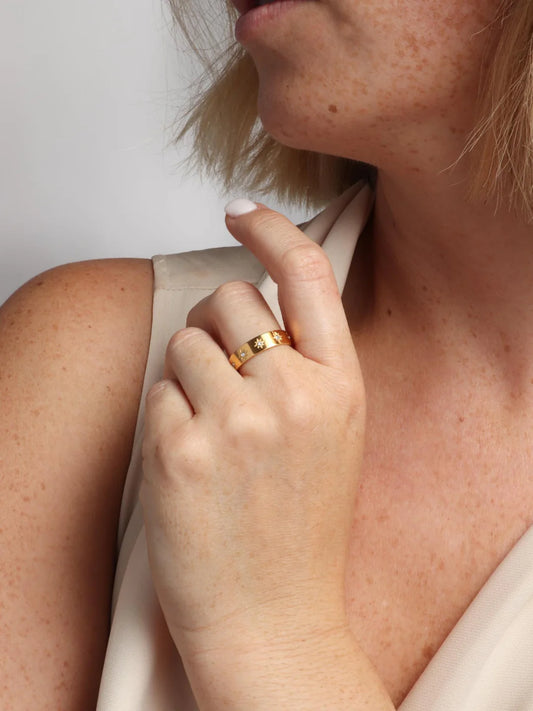 Marrin Costello Orion Ring in gold with checkered pattern worn on finger