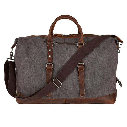Cole Wheeler Canvas and Leather Vintage Duffle in charcoal canvas with brown leather trim, dual handles, and adjustable shoulder strap