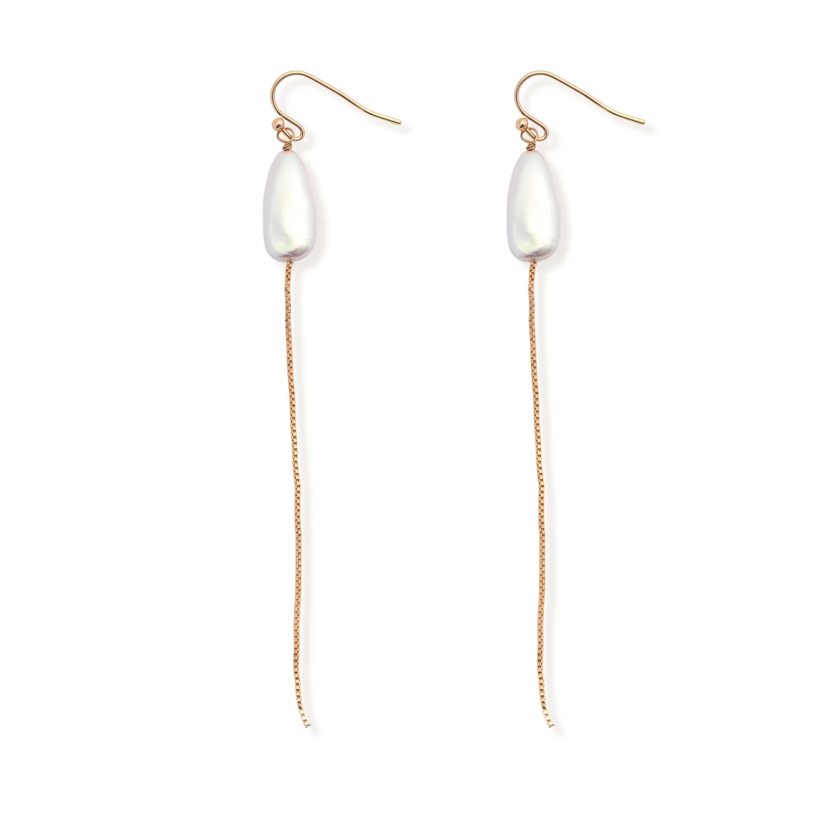 The Leslie Curtis "Pearl" Earrings by Leslie Curtis showcase elongated white pearls suspended from long, delicate gold chains and gold hooks, reminiscent of a matching pearl necklace, and are displayed on a white background.