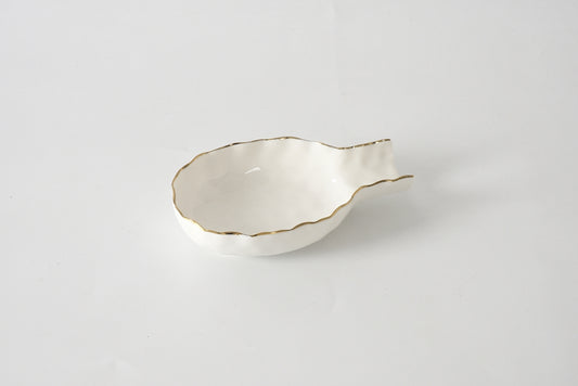 Pampa Bay Portofino Spoon Rest in cream with gold-trimmed scalloped edges and two handles