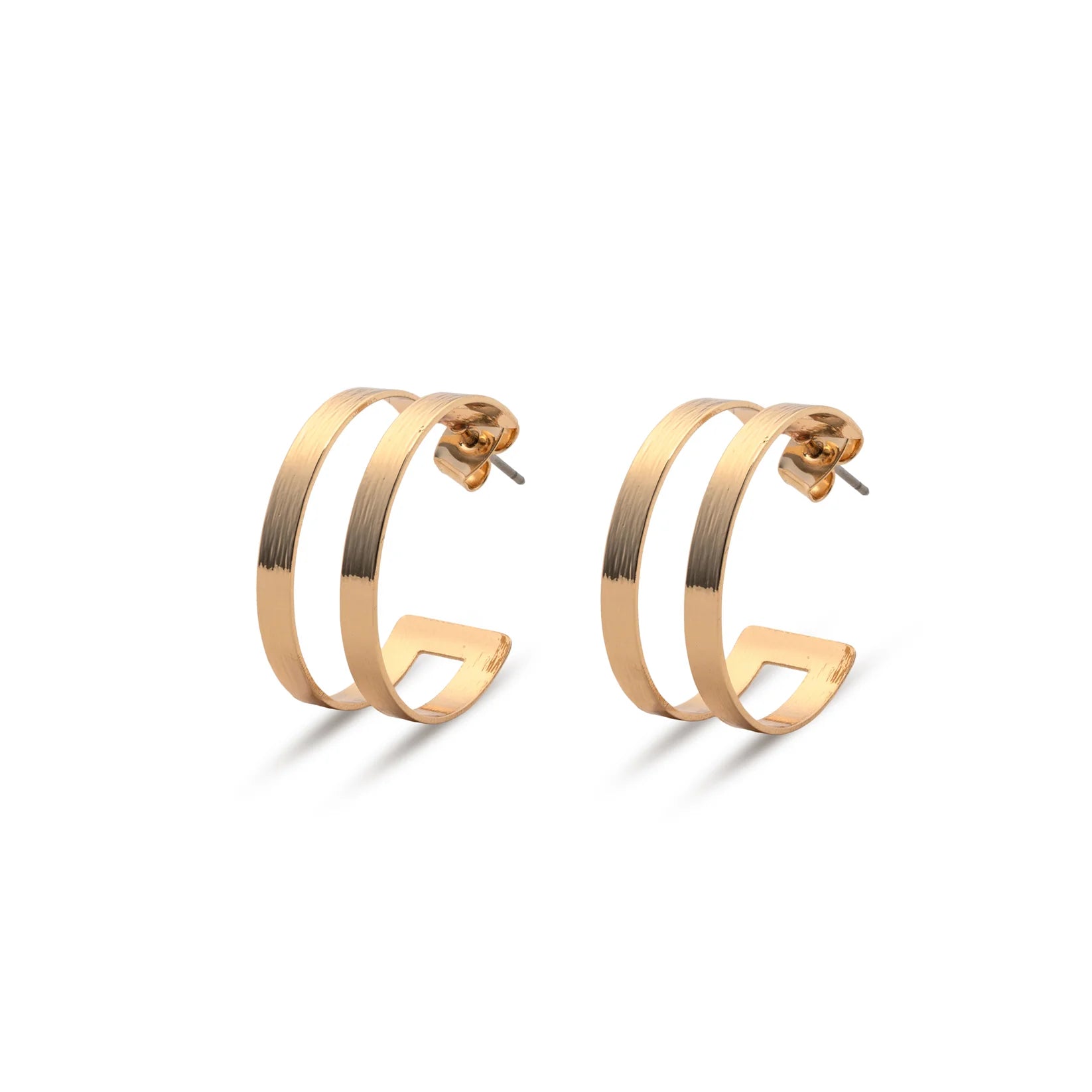The Leslie Curtis Posey Earrings by Leslie Curtis are a pair of gold-tone geometric hoop earrings featuring a double bar design and secure stud post, shown against a white background. These striking 1.5 inch earrings bring modern elegance to any ensemble.
