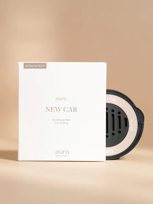 Pura New Car fragrance diffuser refill with white box and black car diffuser device