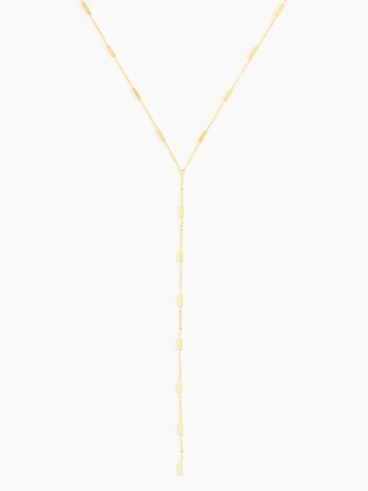 Marrin Costello Regina Lariat Necklace in gold with bar accents, flat lay