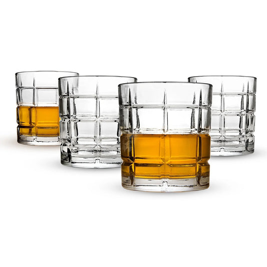 A set of four Shannon by Godinger "Radius" Double Old-Fashioned glasses, each featuring a clear, patterned design, is arranged in a staggered group. Two glasses are empty, while the other two are filled with an amber liquid, likely whiskey or another spirit.
