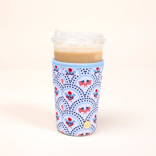 The Darling Effect Sip Savvy Drink Sleeve in light blue with red and navy patriotic flag pattern on tall beverage cup