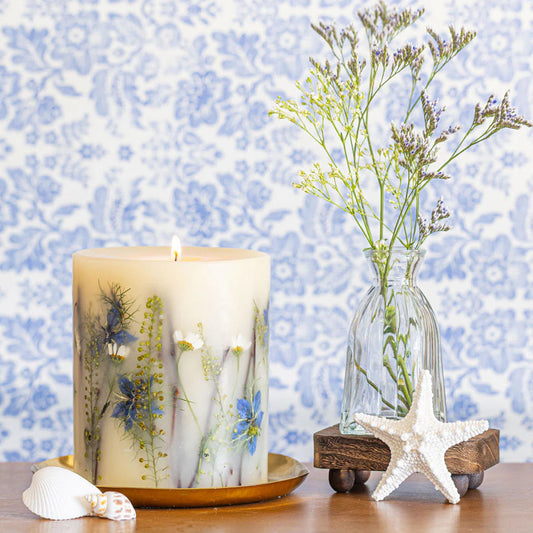 Rosy Rings Accent Botanical Candle with dried wildflowers on brass dish, styled with fresh flowers and starfish