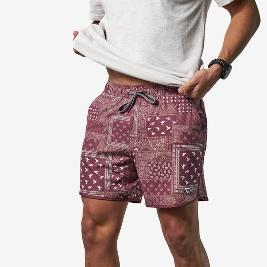 Burlebo Swim Trunk in burgundy with patchwork duck and bandana print, side view