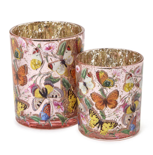 Two's Company Butterfly Silhouette Candleholders pair in pink with butterfly prints and gold interiors, different heights