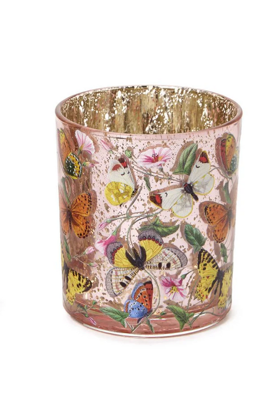 Two's Company Butterfly Silhouette Candleholder with pink glass exterior featuring colorful butterfly and floral design, gold interior