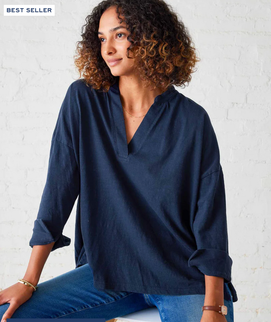 Mersea Amelia Cuff Tee in navy linen with V-neckline and rolled three-quarter sleeves, worn with blue jeans