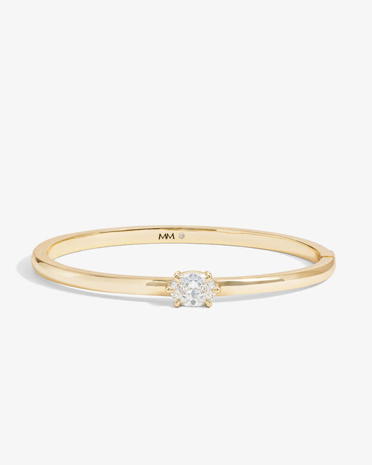 Melinda Maria She's on Point gold cuff bracelet with cushion-cut diamond center