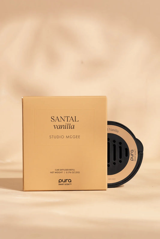 Studio McGee Santal Vanilla car diffuser refill in tan box with black and peach Pura device