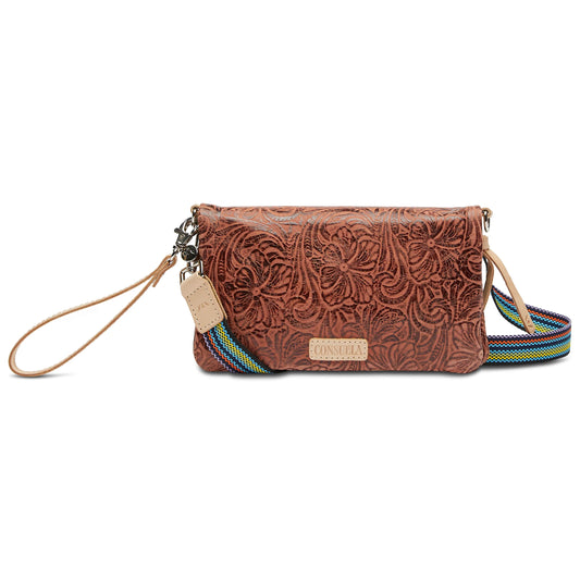 Consuela Uptown crossbody in cognac tooled leather with rainbow woven strap, front view with wristlet strap