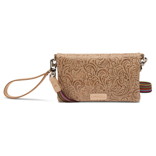 Consuela Uptown crossbody in tan tooled leather with multicolor woven strap, top view showing flap closure