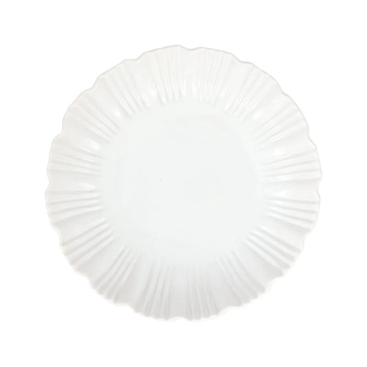 A white, round Vietri Bari White Shallow Serving Bowl with a scalloped, textured edge, viewed from above on a plain background. This Vietri serving bowl is microwave and dishwasher safe, combining elegance with everyday convenience.