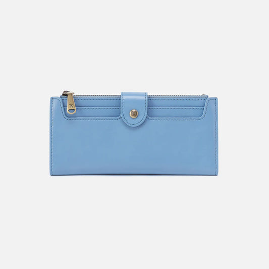 HOBO Dunn Continental Wallet in periwinkle blue leather with snap button and multiple compartments