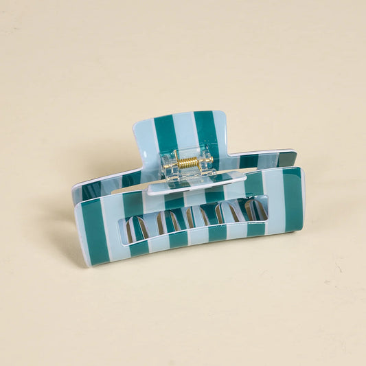 The Darling Effect Claw Clip in teal and white vertical stripes, open position showing interior detail