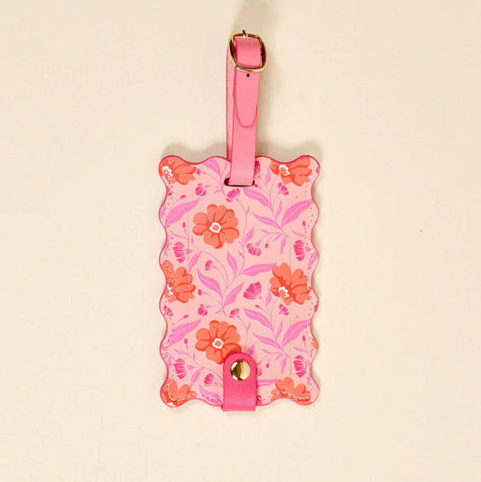 The Darling Effect Jetsetter Luggage Tag with scalloped edges, pink background with orange and red floral print and pink strap