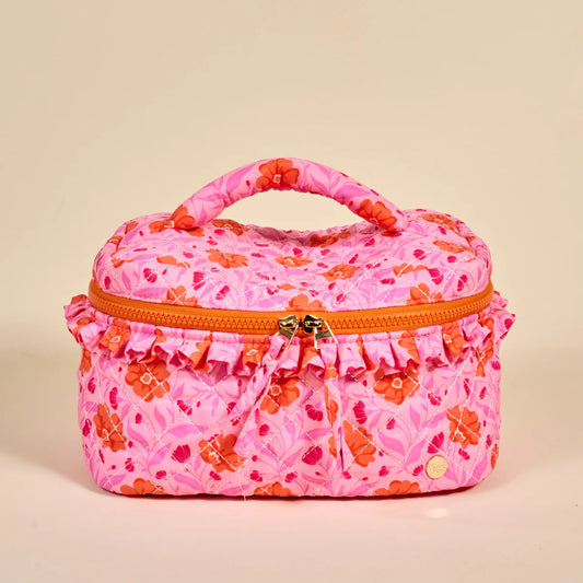 The Darling Effect Glam & Go Quilted Cosmetic Bag in pink with orange and red floral pattern, front view with handles