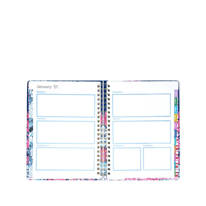 A Lilly Pulitzer by Lifeguard Press Jumbo 17 Month Agenda, In All Her Glory, lies open to the weekly layout for January 2027, featuring spacious daily boxes and vibrant floral borders in the signature colorful style.