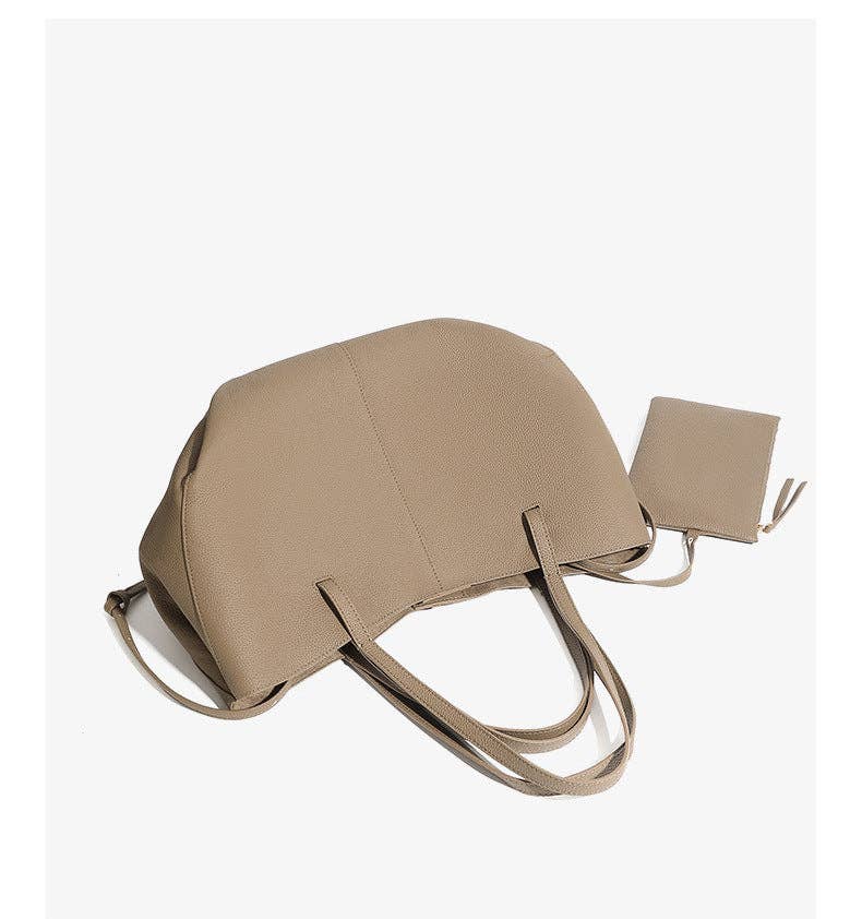 Parker & Hyde Brooklyn Tote in Oyster, featuring two handles and a matching small zippered pouch, both made from textured material and shown against a plain white background.