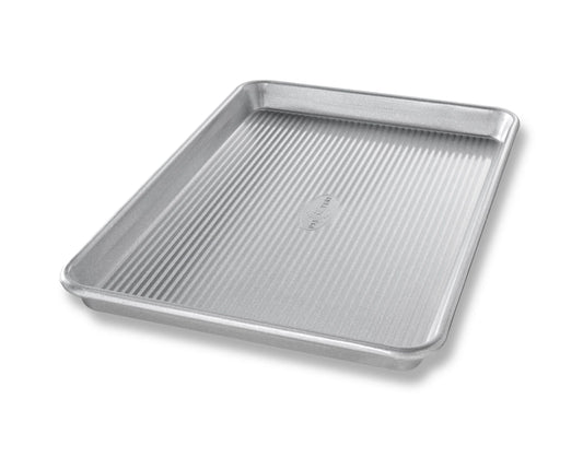 USA Pan Jelly Roll Pan with ribbed nonstick surface, silver aluminum, angled view