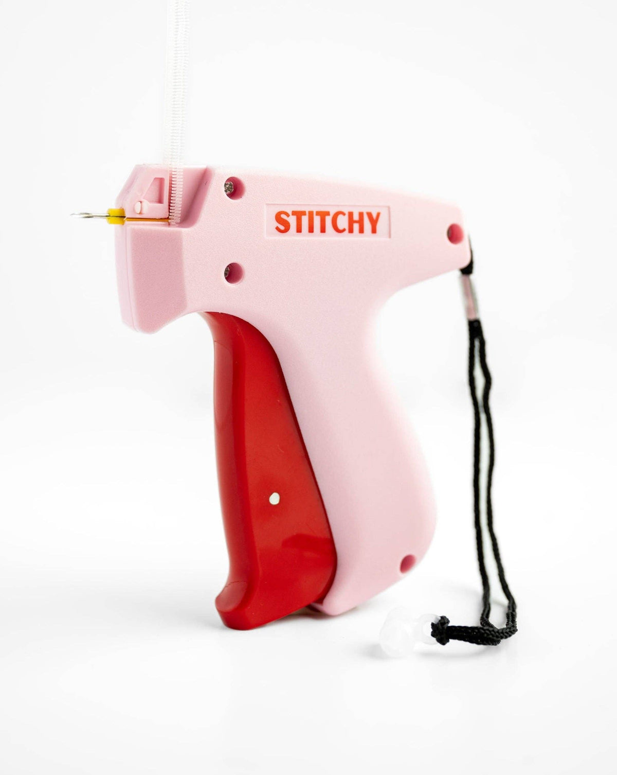 Tucky Stitchy tag gun in pink and red with yellow needle and black cord lanyard