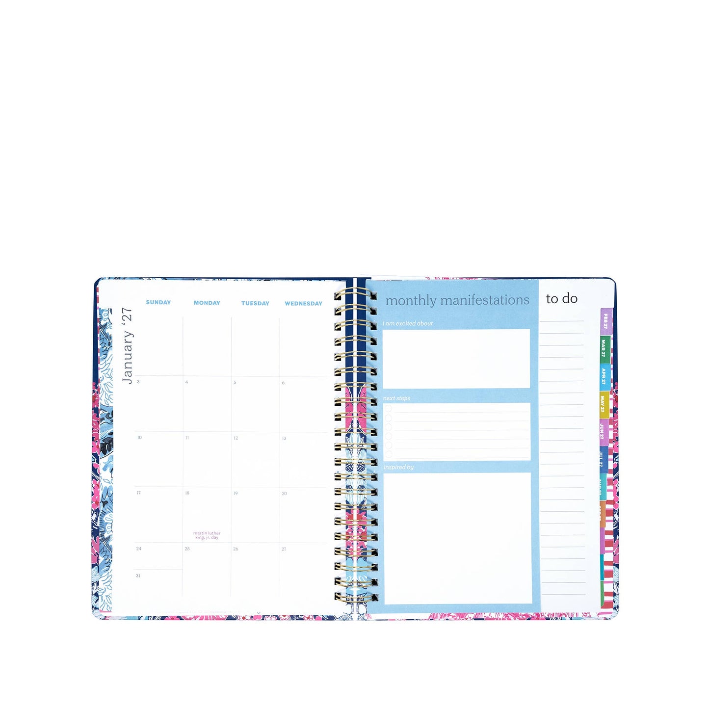 An open Lilly Pulitzer by Lifeguard Press - Jumbo 17 Month Agenda, In All Her Glory is displayed, featuring a monthly calendar on the left and sections for monthly manifestations and a to-do list on the right, all highlighted with colorful edges.