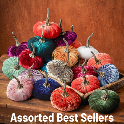A selection of large velvet pumpkins from Your Heart’s Content is beautifully displayed on wooden surfaces, offering the ideal handcrafted fall mantel or Halloween table decor for your home. The text “Assorted Best Sellers” is featured at the bottom of the image.