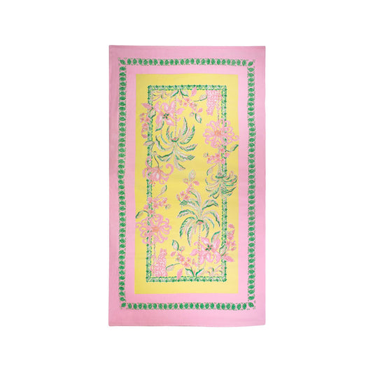 Lilly Pulitzer Tropical Oasis beach towel with pink border, yellow center, and pink flowering vine pattern with green details