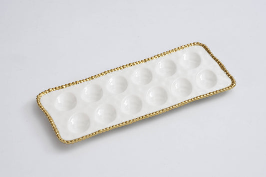Pampa Bay Deviled Egg Tray in white with gold beaded rim, rectangular shape with 12 cup indentations