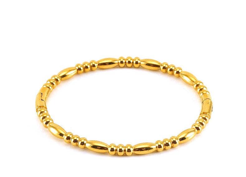 Introducing the Mio Queena - Multi-style 18K Gold-plated Stainless Steel Bangle - FGS, a beautifully crafted bracelet featuring alternating oval and round bead-like segments arranged in a seamless circular pattern, displayed against a white background. This elegant stainless steel bangle from Mio Queena is a timeless and sophisticated gift for any jewelry lover.