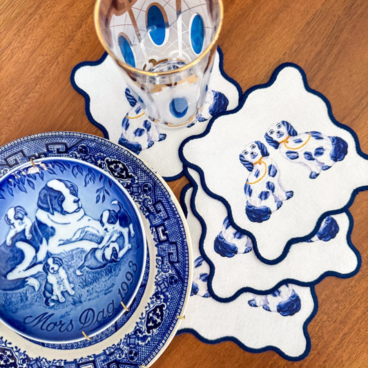 Taylor Paladino Staffordshire Dogs Cocktail Squares styled with matching serveware and decorative plate on wood table