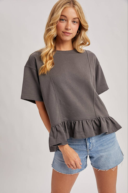 Bluivy ruffled peplum tee, angled front view showing boxy fit and ruffle hem detail