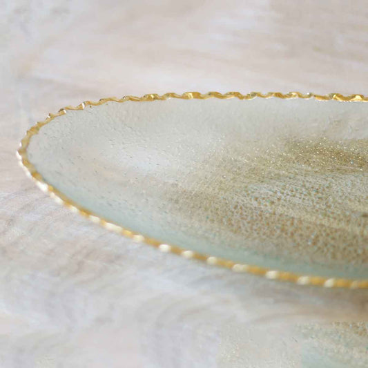 The Royal Standard Fairbanks Oval Platter in clear glass with gold rim, detail view showing textured surface