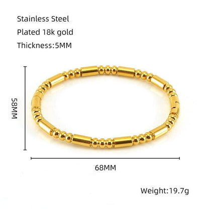 Introducing the Mio Queena - Multi-style 18K Gold-plated Stainless Steel Bangle - FGS by Mio Queena. Crafted from gold-colored stainless steel with 18K gold plating, this elegant bracelet measures 68mm in diameter and 5mm thick, and weighs 19.7g. Its timeless design features a combination of round and cylindrical beads—making it a perfect jewelry gift.