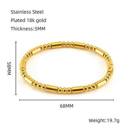 Introducing the Mio Queena - Multi-style 18K Gold-plated Stainless Steel Bangle - FGS by Mio Queena. Crafted from gold-colored stainless steel with 18K gold plating, this elegant bracelet measures 68mm in diameter and 5mm thick, and weighs 19.7g. Its timeless design features a combination of round and cylindrical beads—making it a perfect jewelry gift.