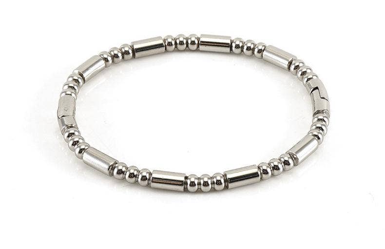 Introducing the Mio Queena - Multi-style 18K Gold-plated Stainless Steel Bangle by Mio Queena, shown on a white background—a stylish and elegant accessory crafted with alternating small round and cylindrical beads. This versatile bangle makes an ideal jewelry gift or the perfect choice to elevate any ensemble.