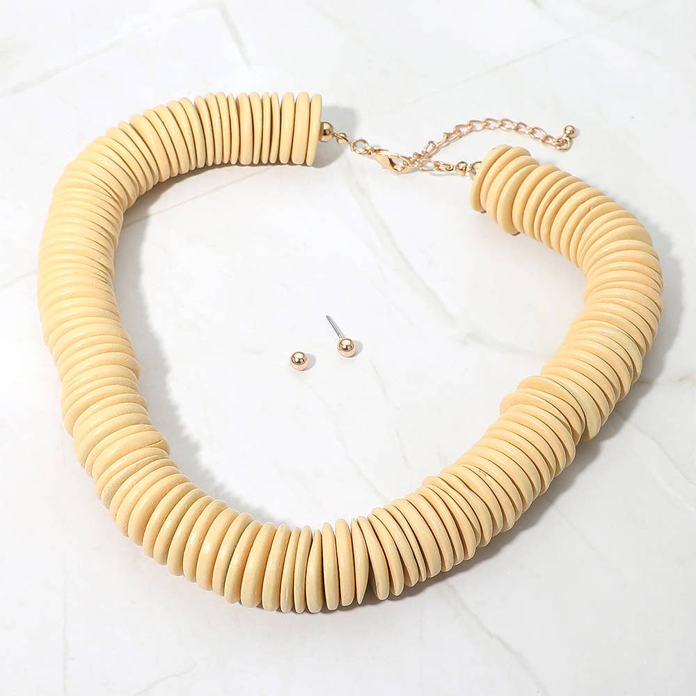 Sensibling Corp. chunky wooden disc beaded statement necklace in natural wood with stud earrings, overhead view