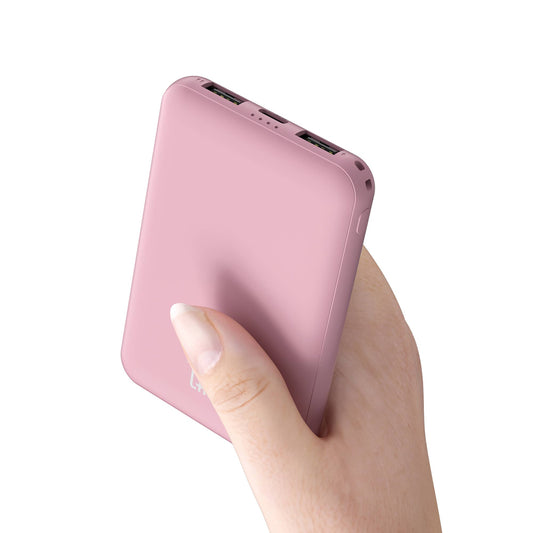LAX Gadgets 6600mAh ultra-slim pink power bank held in hand, showing dual USB ports on top