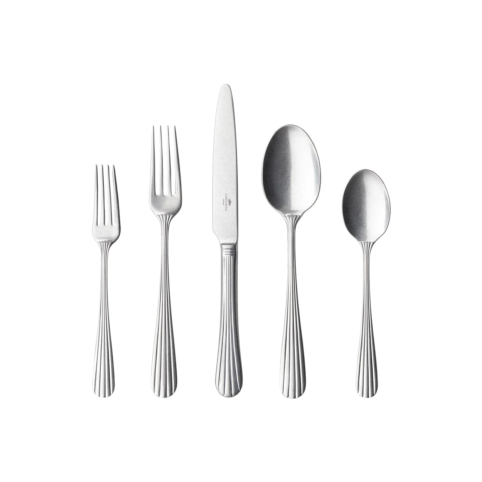 Five pieces of Costa Nova “Douro” stainless flatware—a salad fork, dinner fork, knife, tablespoon, and teaspoon with matching handles—are arranged side by side on a white background.